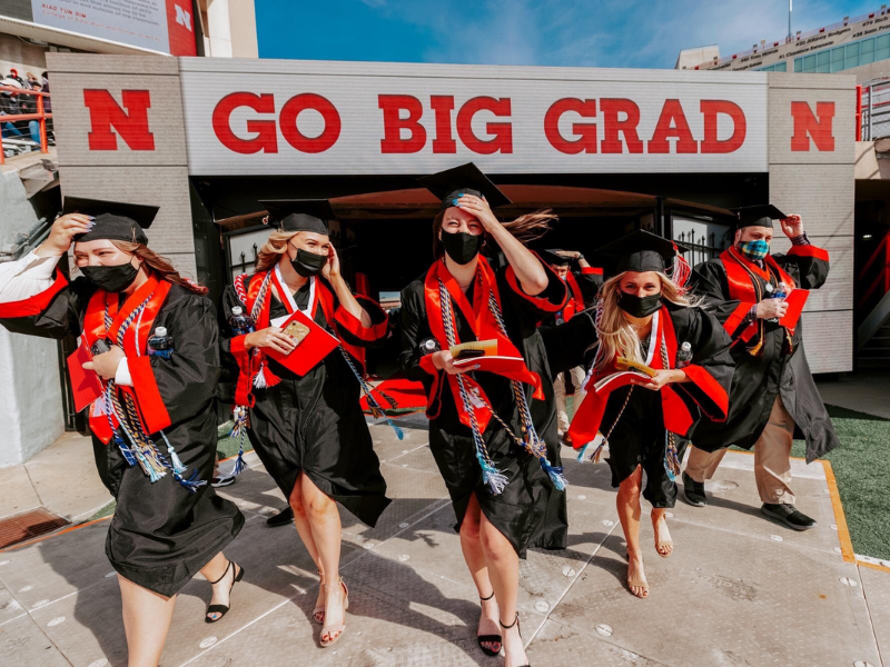 Photo by University Communications, CoJMC students running out of memorial stadium tunnel